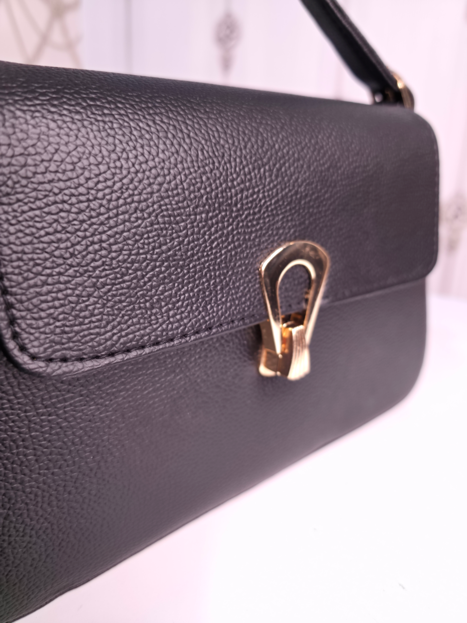 Black twisted two compartment handbag