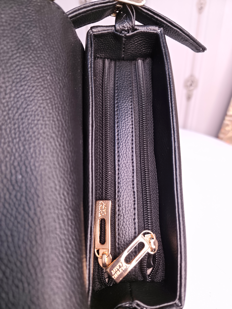 Black twisted two compartment handbag