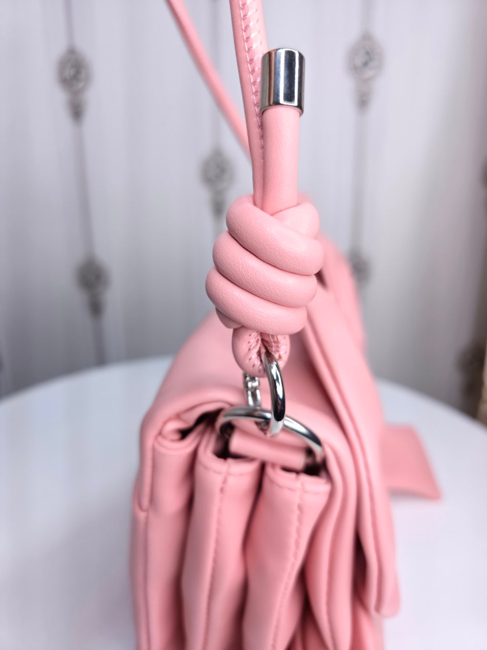 Soft leather peach bow bag with detachable sling