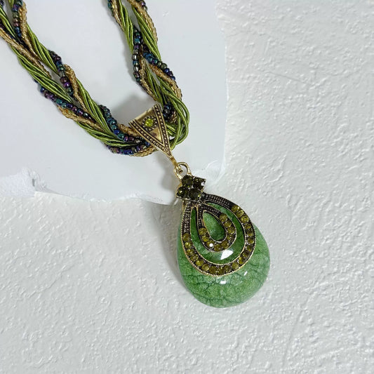 Multi-Strand Beaded Necklace with Ornate Teardrop Pendant
