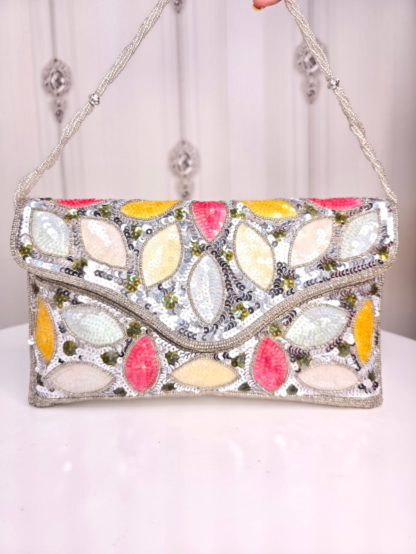 Party wear Multi coloured leaves designed stone embroidered clutch