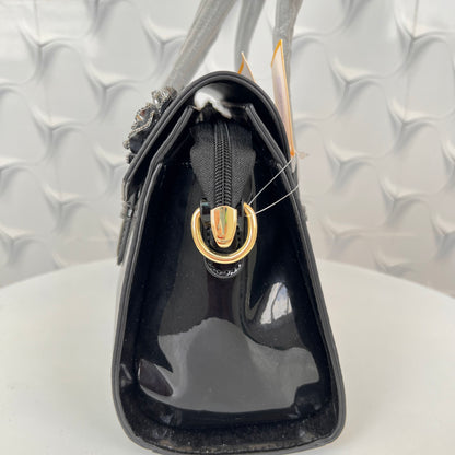 Designer shining leather handbag with stonework