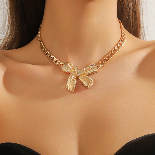 Chunky Gold Chain Necklace with Textured Bow Pendant