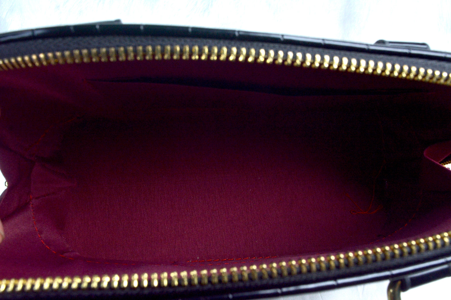 Sleek and Black medium sized handbag