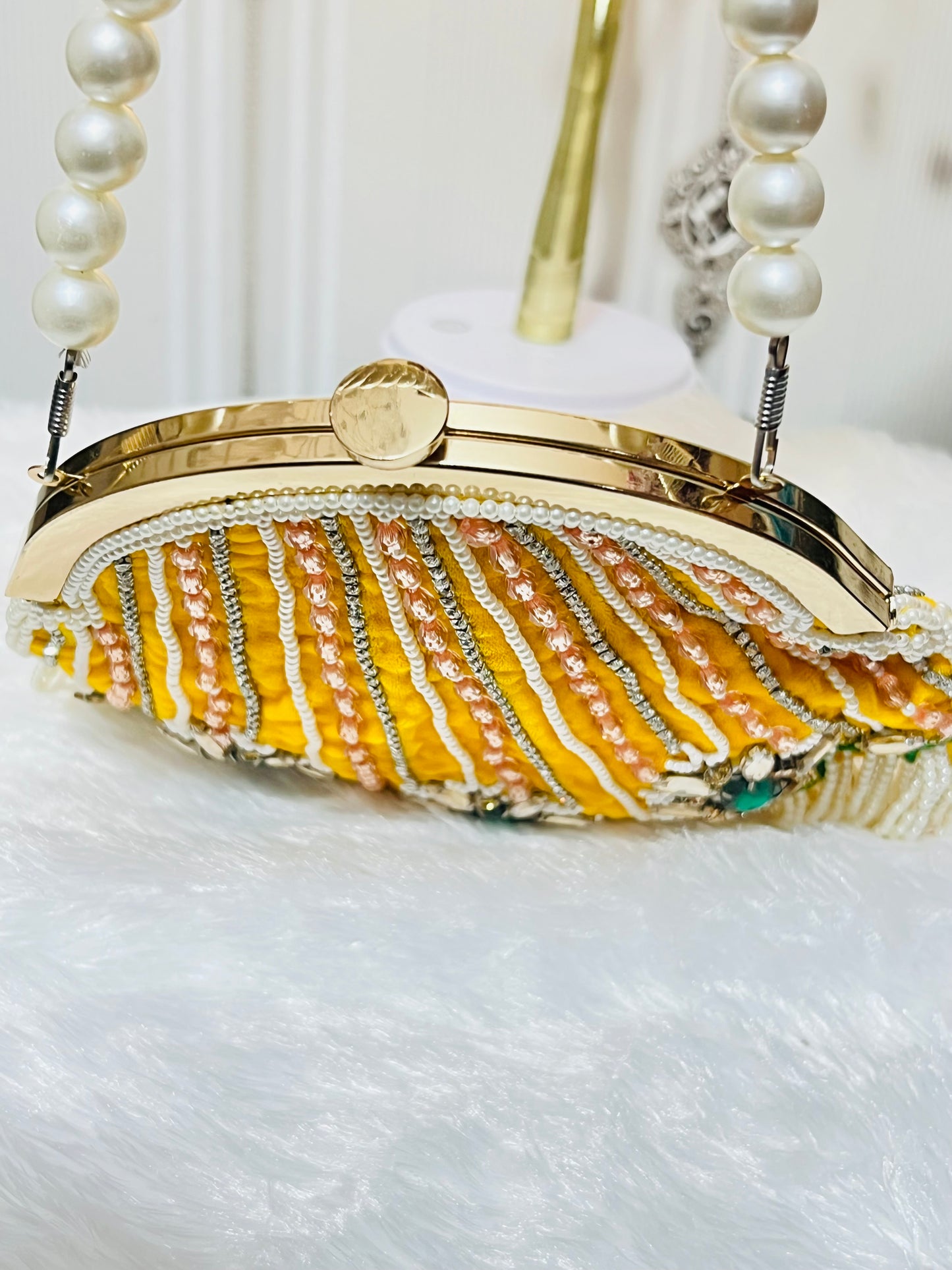 Pearl Tessle oval clutch with pearl sling