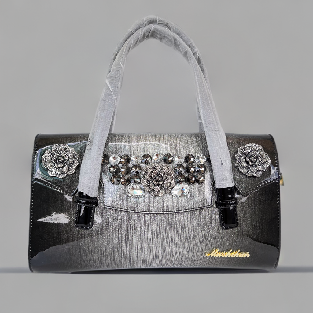 Designer shining leather handbag with stonework