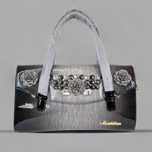 Designer shining leather handbag with stonework