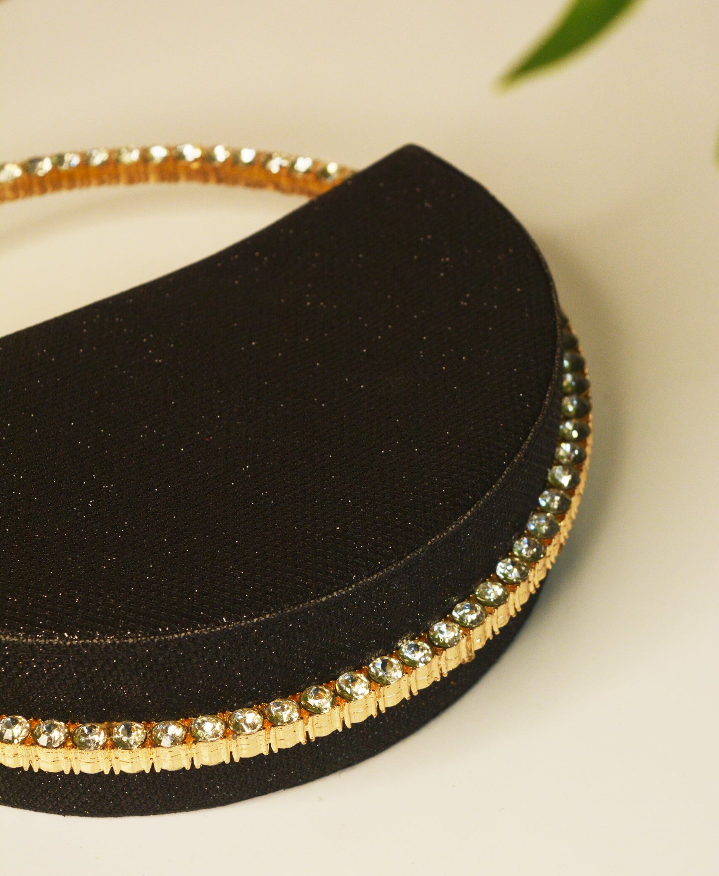 Sequence Semi circle clutch bag with stone handle