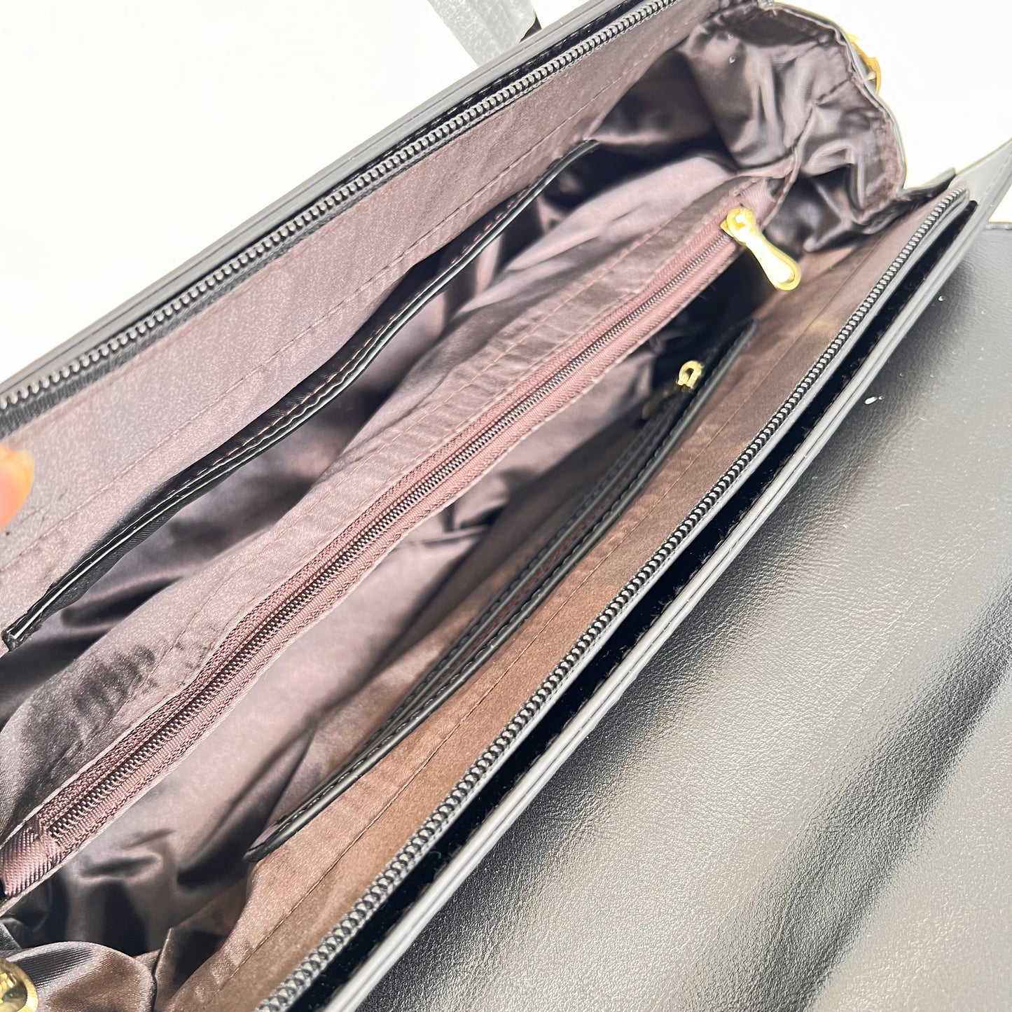 Designer shining leather handbag with stonework