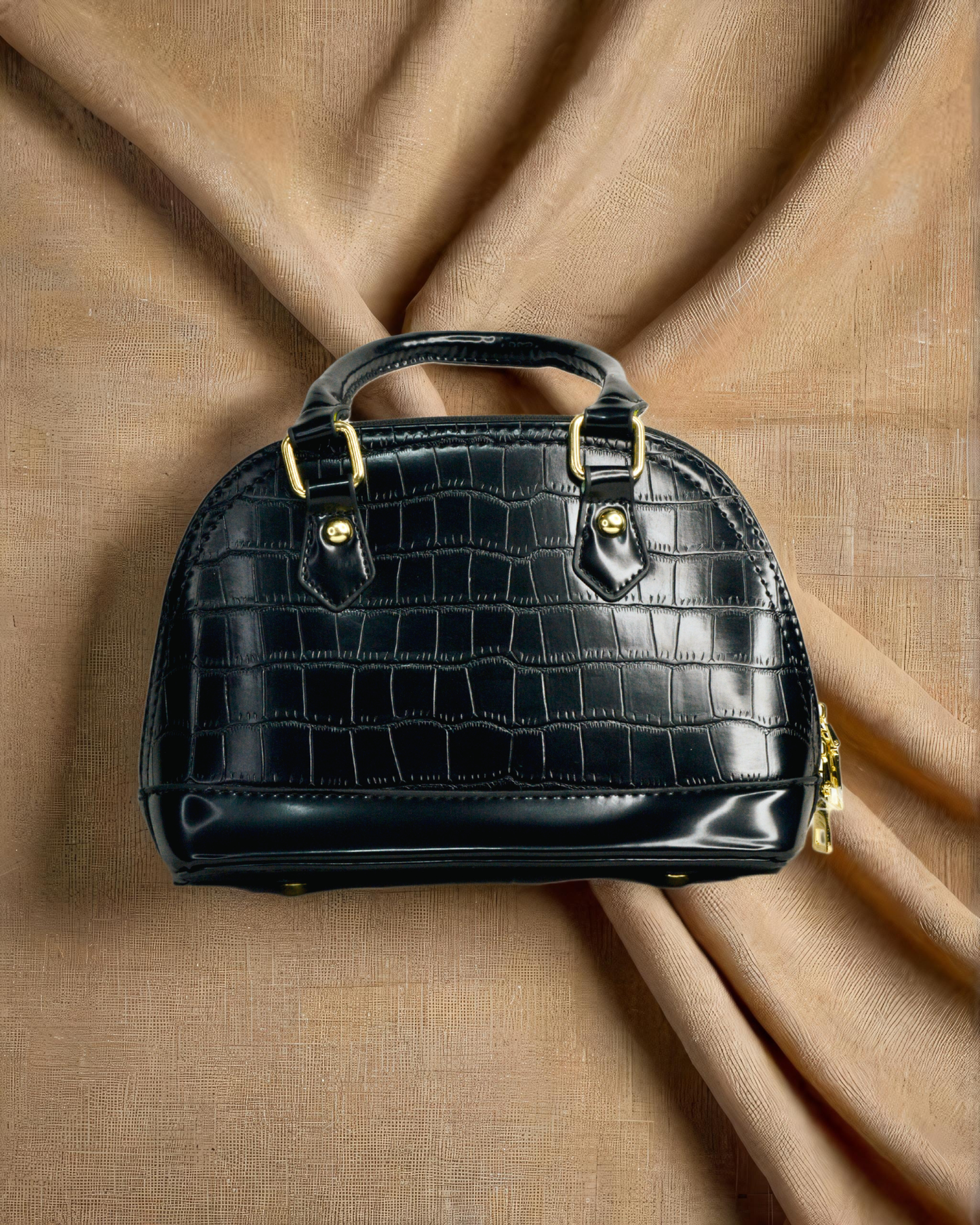 Sleek and Black medium sized handbag