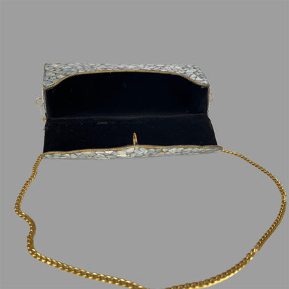 Marble finish metallic clutch