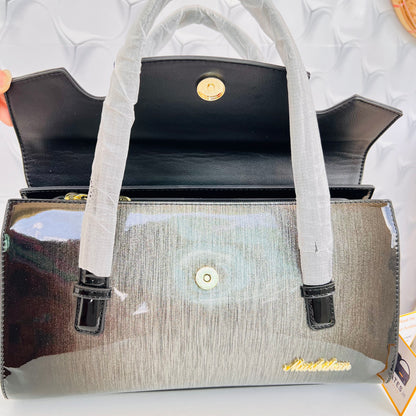 Designer shining leather handbag with stonework