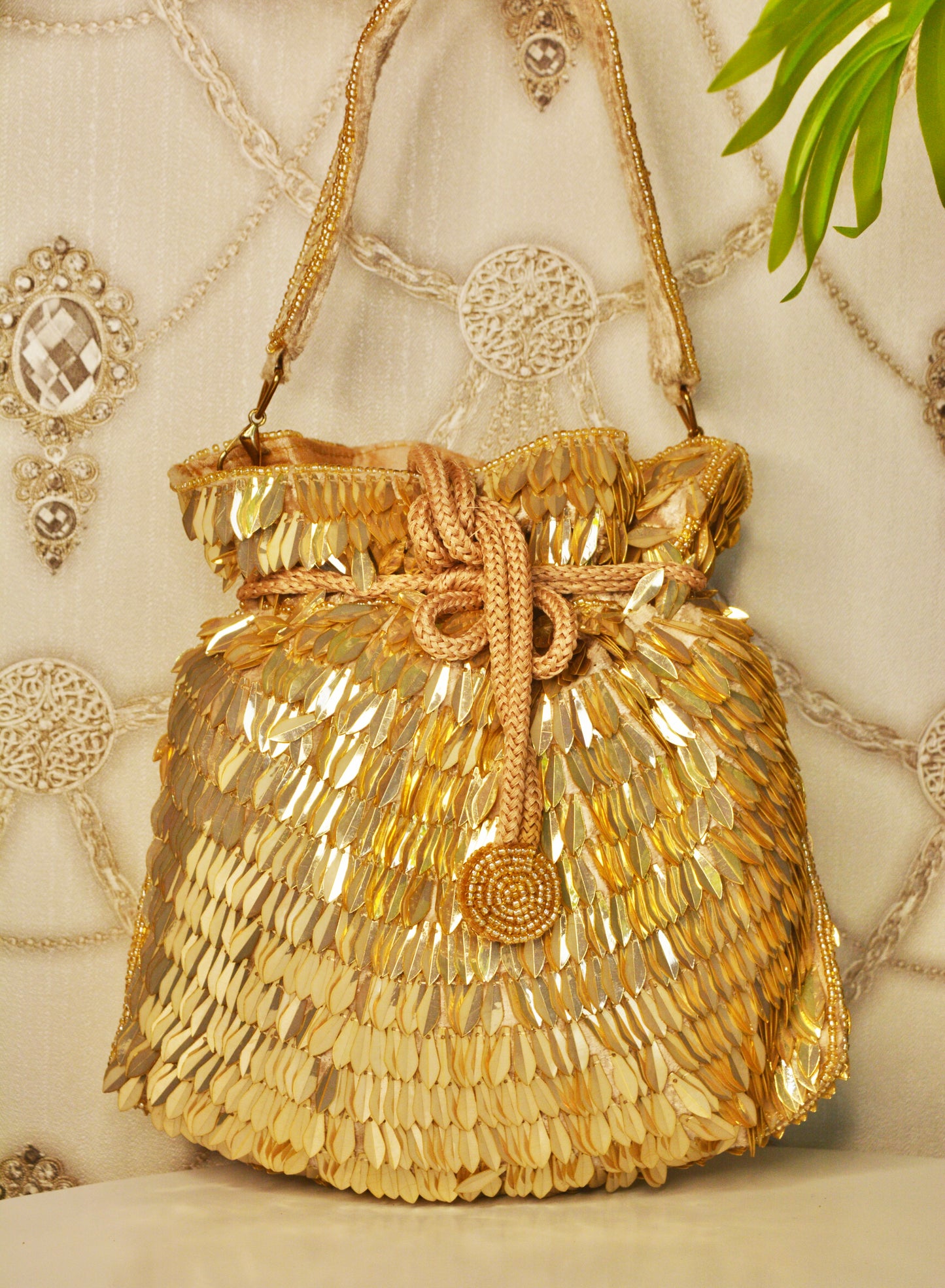 sequenced leaves assorted party wear potli