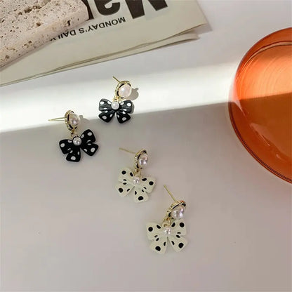 Chic Polka Dot Bow Earrings with Pearls - Stylish and Playful