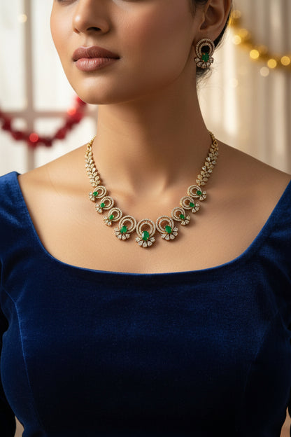 Gold necklace with green gemstones on a mannequin bust