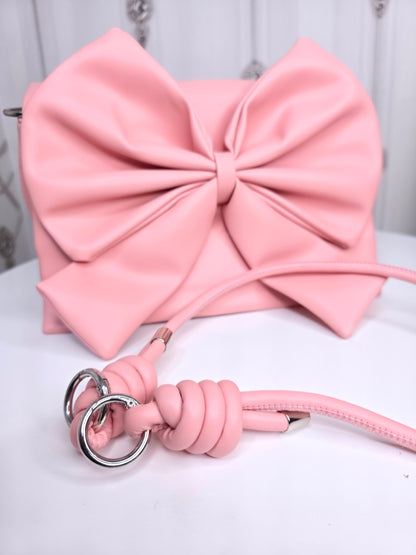 Soft leather peach bow bag with detachable sling