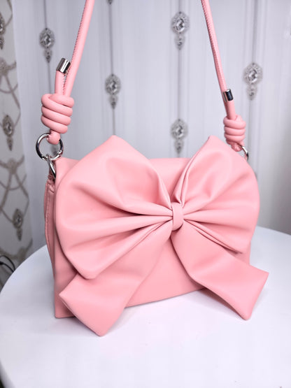 Soft leather peach bow bag with detachable sling