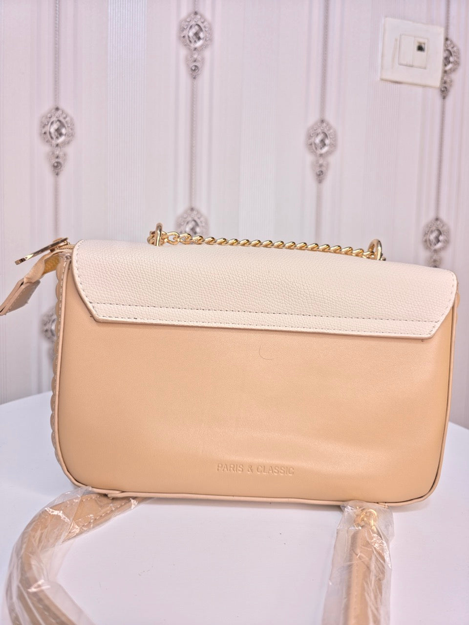 Stylish girl metallic sling handbag