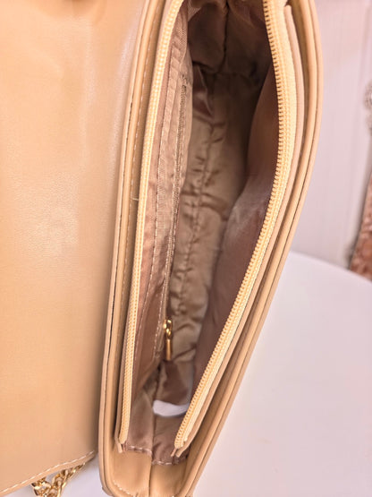 Stylish girl metallic sling handbag