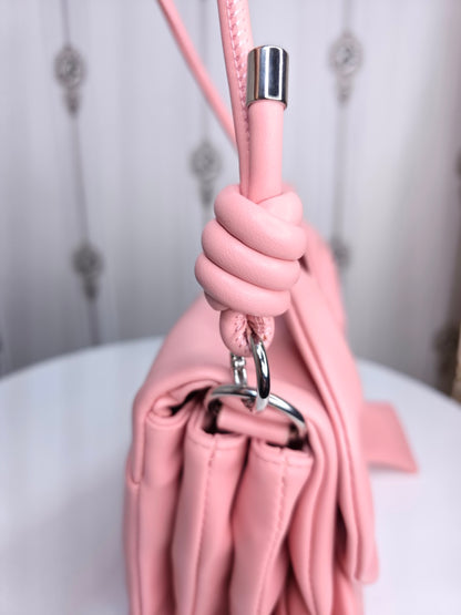 Soft leather peach bow bag with detachable sling