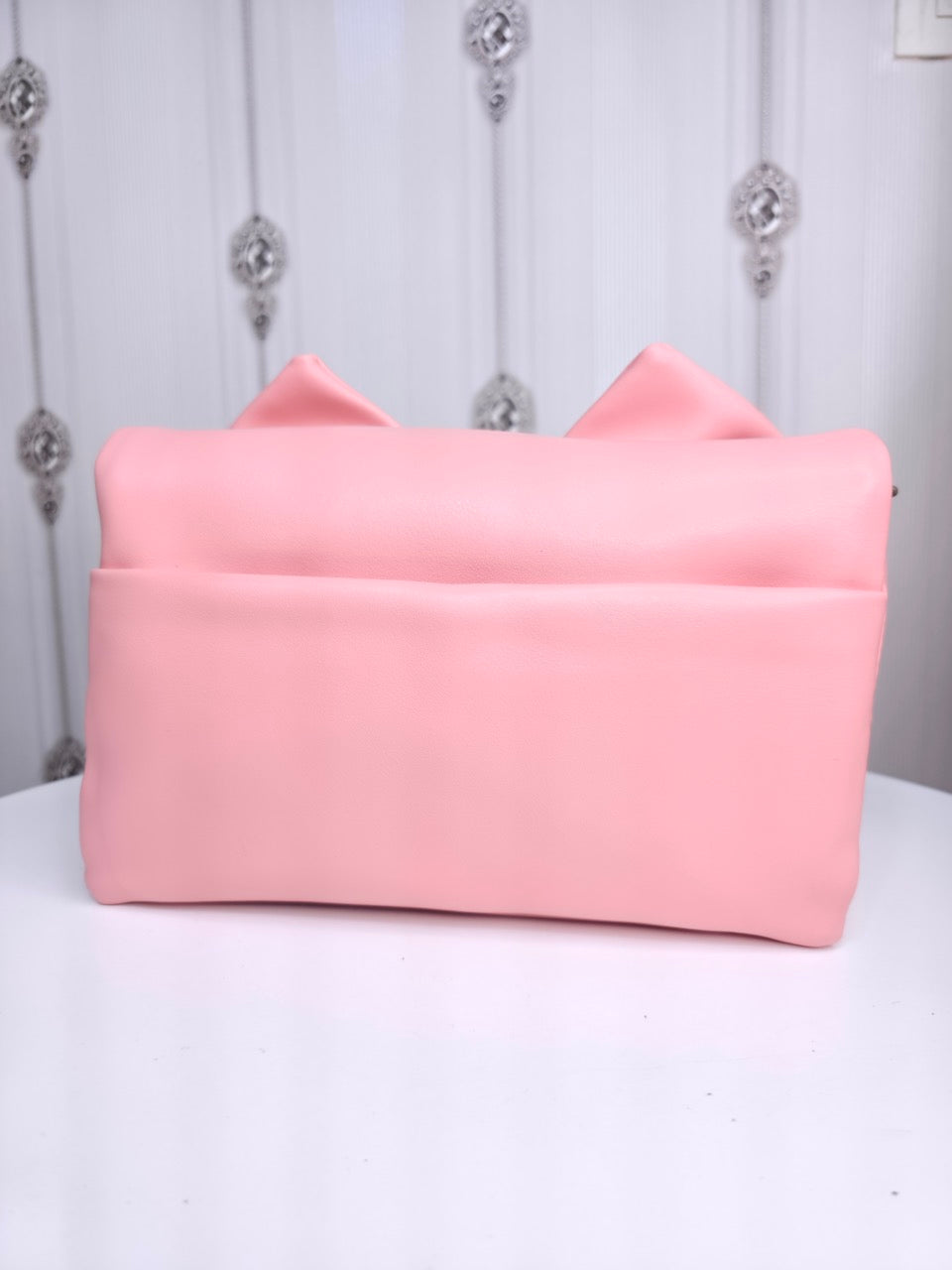 Soft leather peach bow bag with detachable sling