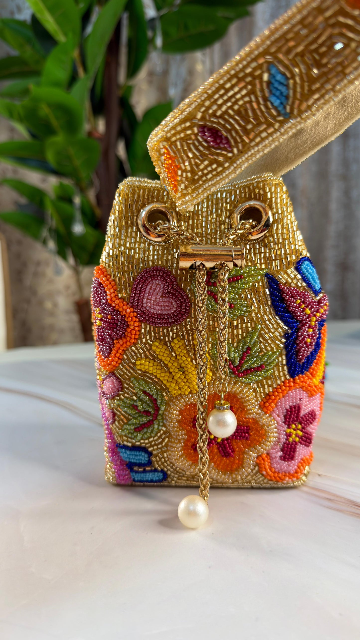 Golden Beaded Potli Bag with Colorful Floral Embroidery