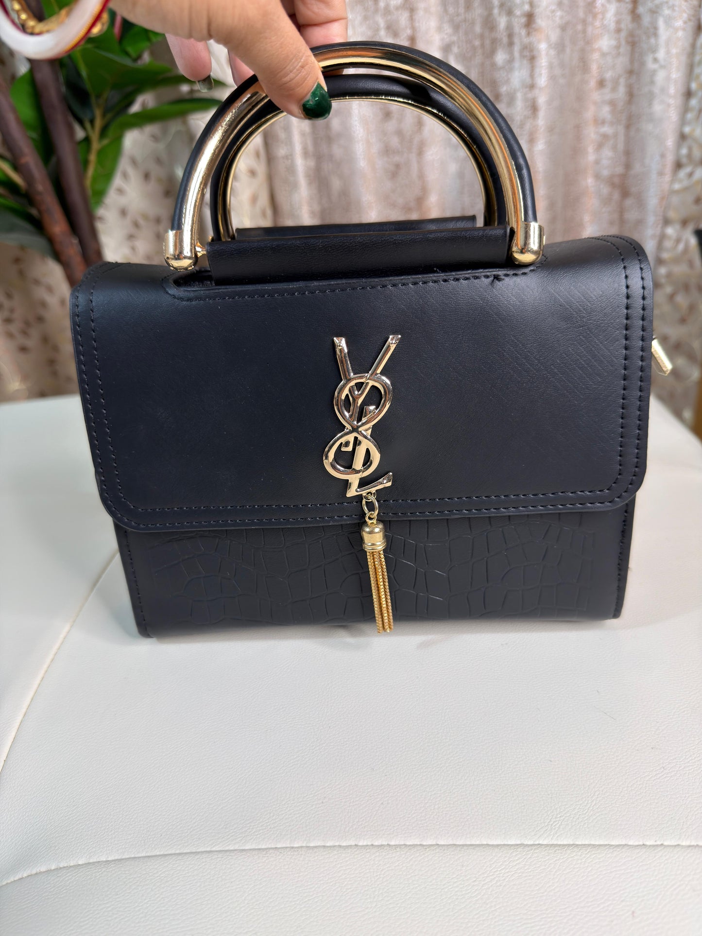 Elegant Black Top-Handle Bag with Gold Accents