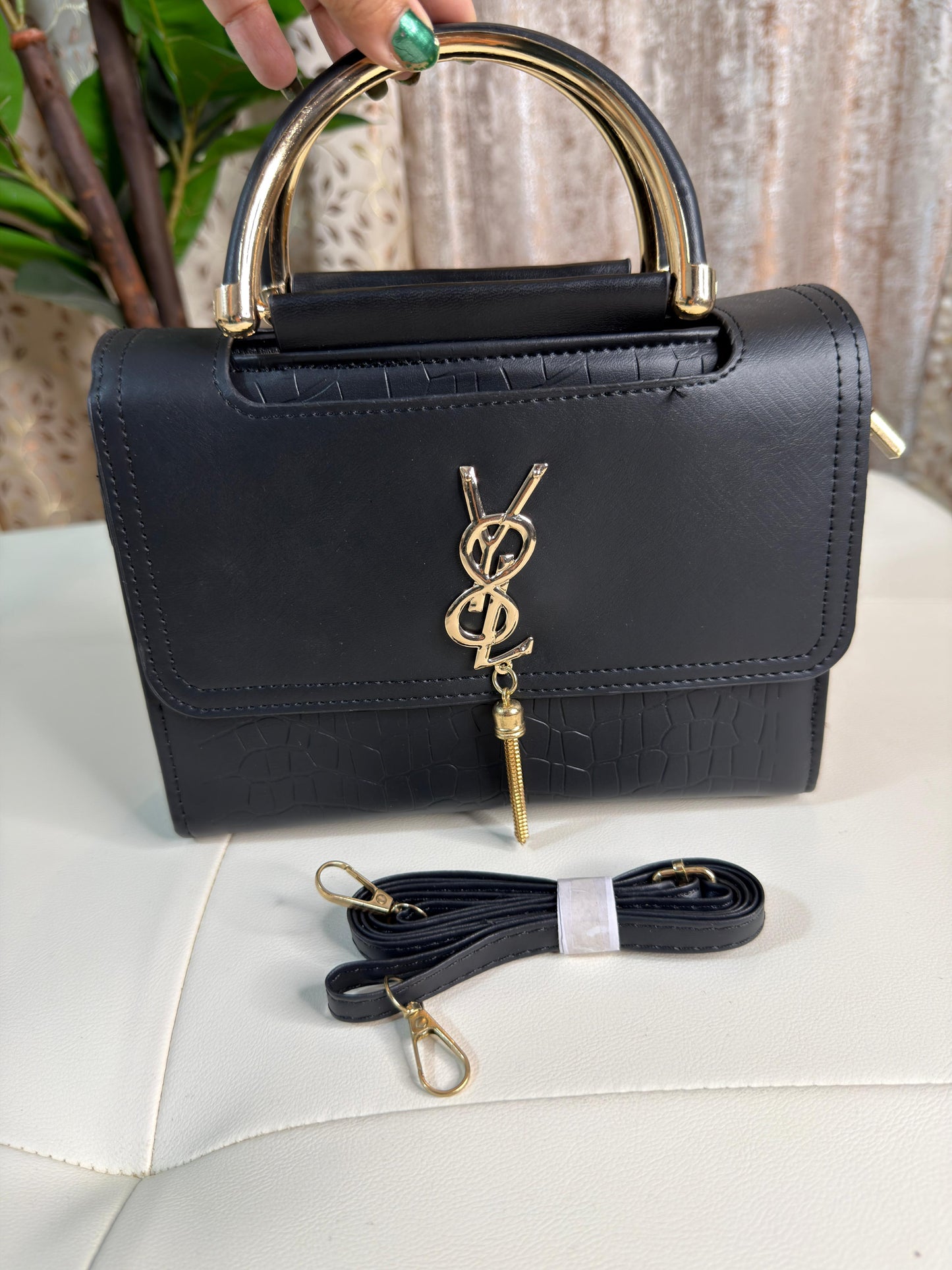 Elegant Black Top-Handle Bag with Gold Accents