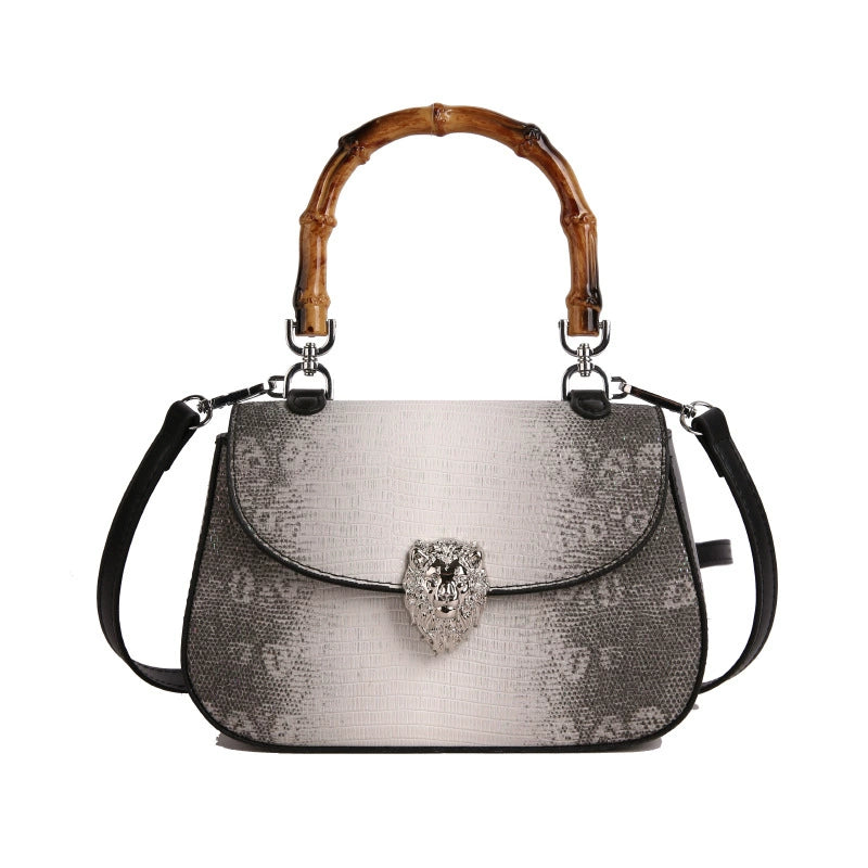 Chic Snake Print Crossbody Bag with Bamboo Handle & Lion Clasp