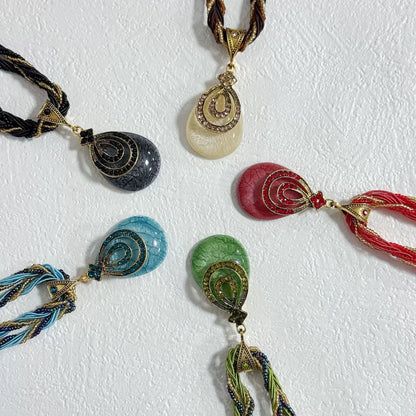 Multi-Strand Beaded Necklace with Ornate Teardrop Pendant
