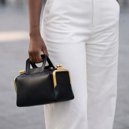 Elegant Black Leather Frame Bag with Gold Clasp