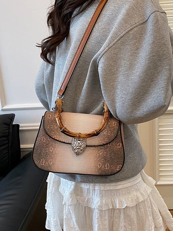 Chic Snake Print Crossbody Bag with Bamboo Handle & Lion Clasp