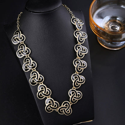 Elegant Gold-Tone Black Enamel Celtic Knot Necklace