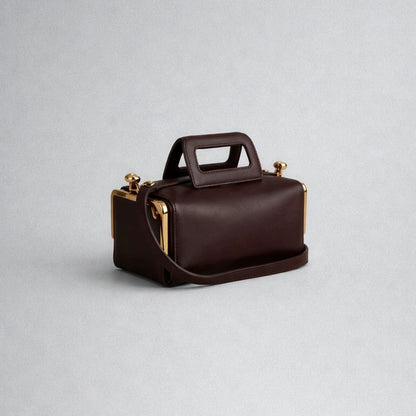Elegant Black Leather Frame Bag with Gold Clasp