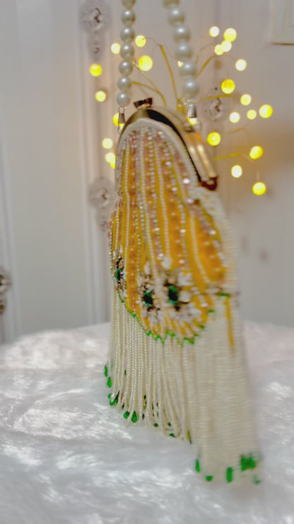 Pearl Tessle oval clutch with pearl sling