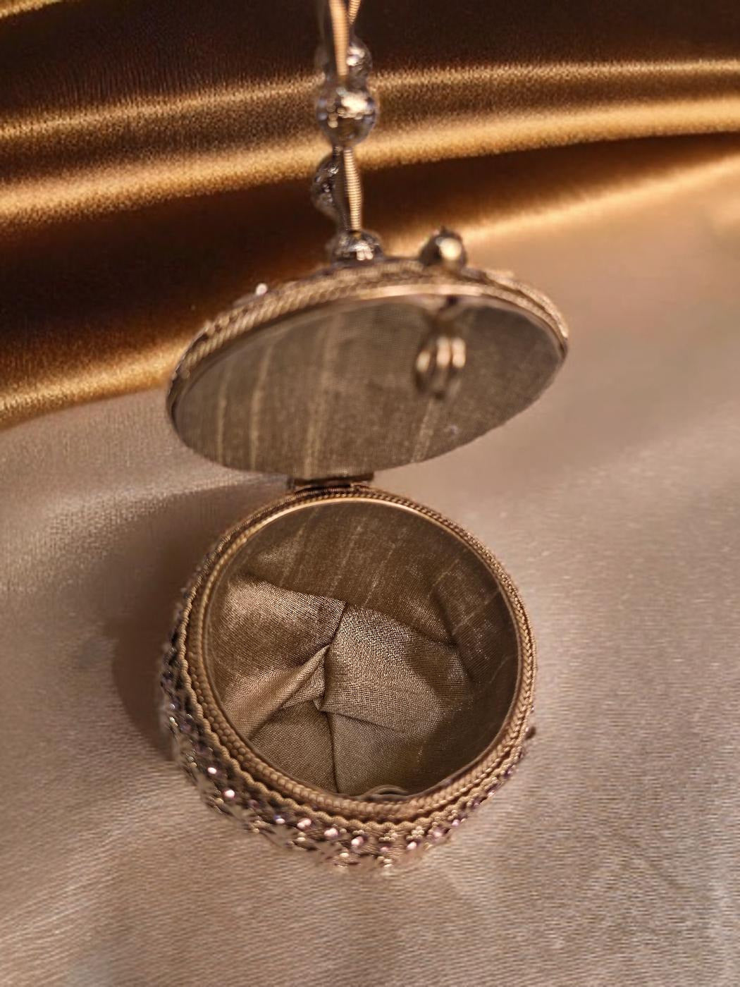 Small sized gold Noor Potli round
