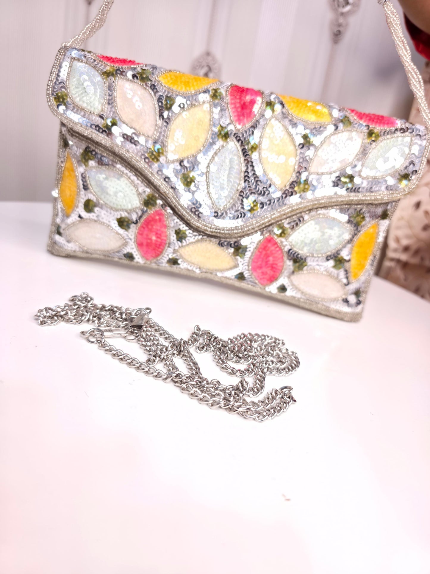 Party wear Multi coloured leaves designed stone embroidered clutch