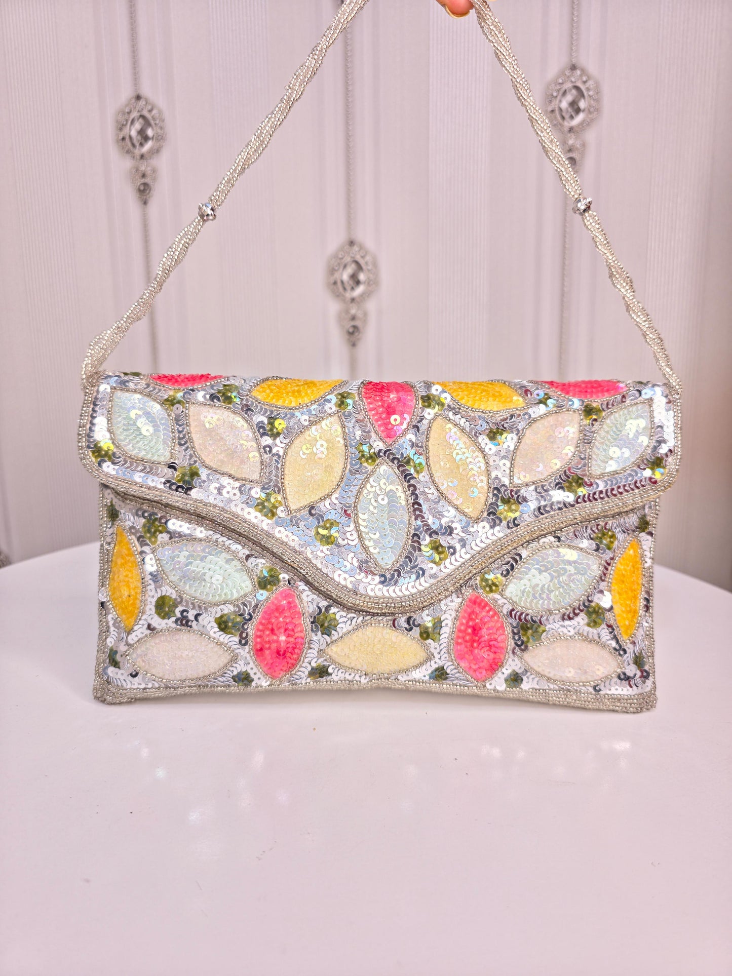 Party wear Multi coloured leaves designed stone embroidered clutch