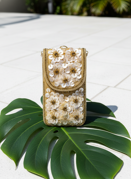 Decorative phone case with floral patterns on a green leaf